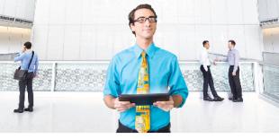 Male in atrium holding notebook
