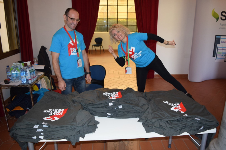 francesca tosi and colleague preparing tshirts for event