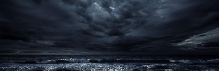 Crashing waves on a beach at night