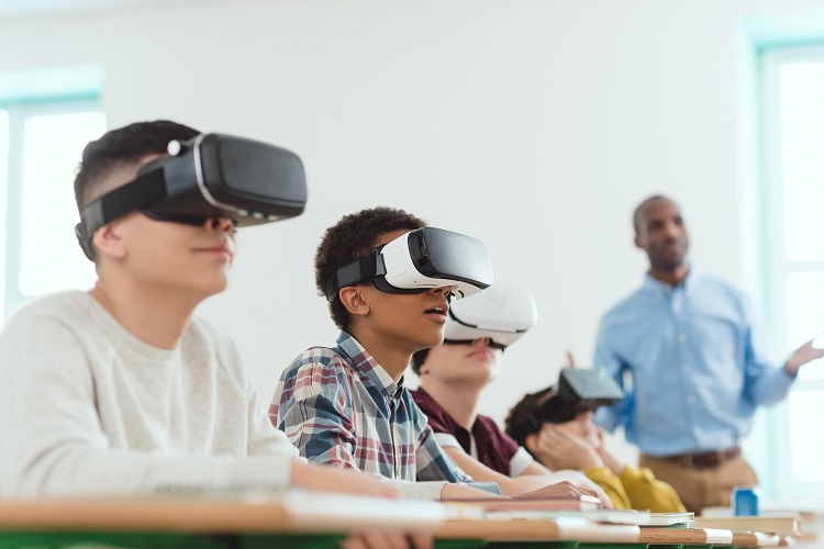 children with VR headsets in a classroom