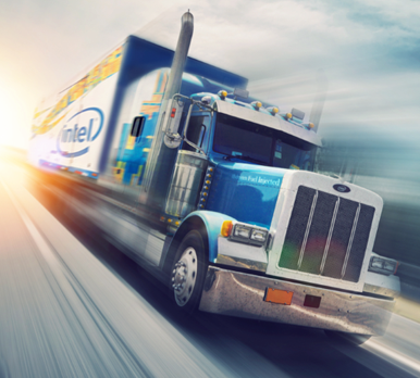 Image of a large semi truck with intel logo on the side, speeding down the road
