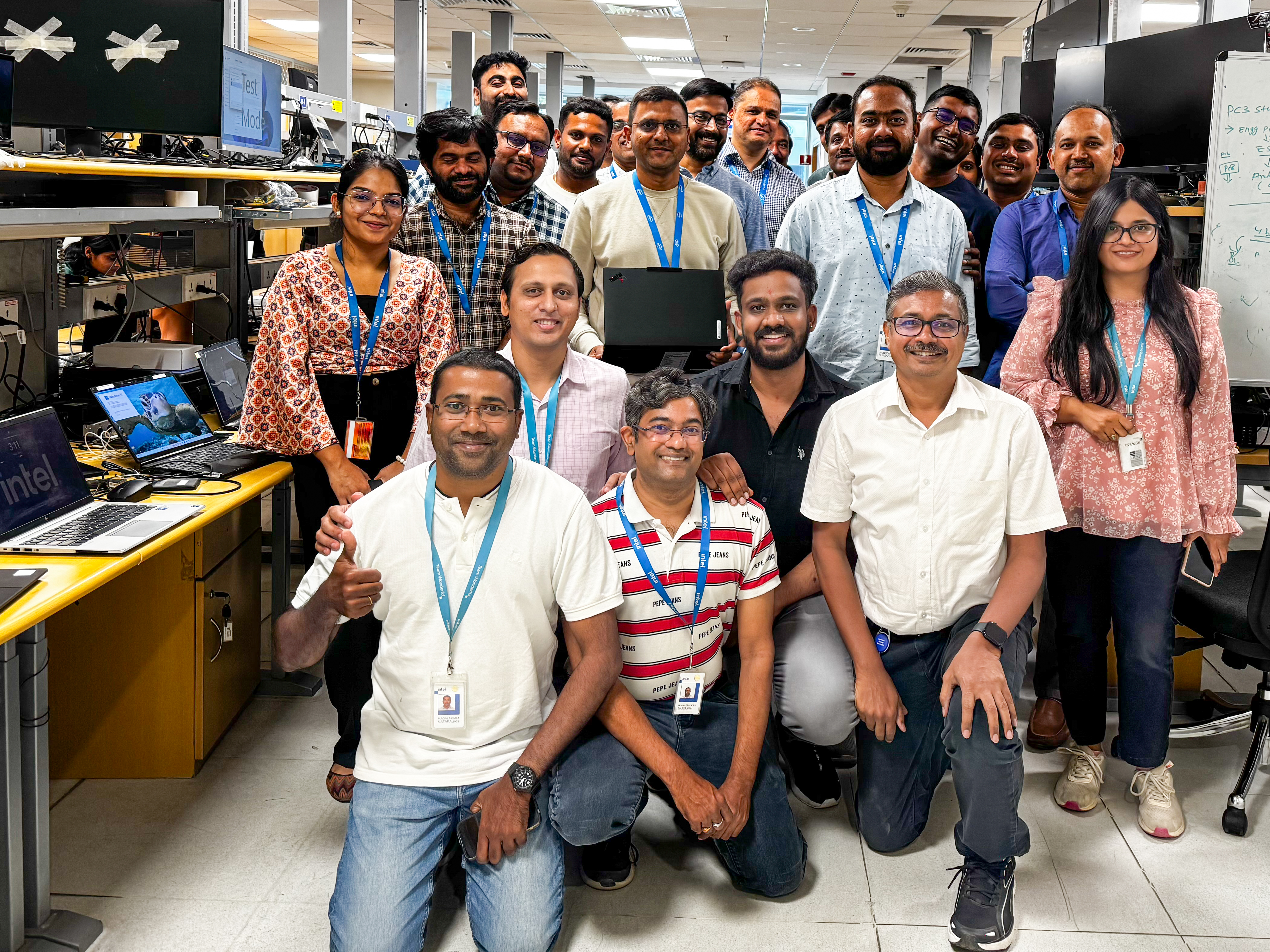 Bhavesh Shroff (center, holding the latest Lenovo Aura Edition PC), senior director of Platform Customer Engineering in the Client Computing Group at Intel, poses with the Intel team at the company’s engineering lab in Bengaluru, India, in April 2025. (Credit: Intel Corporation)