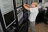 In San Francisco, Calif., on Monday, August 22, 2005, Steve Waskul, with Intel's SCD department, works on a display before the opening day of the Intel Developer Forum. (Photo by Intel Press Relations)