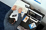 Lon Hohberger, cq, of Red Hat, Inc., helps set up the Advanced Technology Zone featuring Intel Virtualization Technology on Level Two at Moscone West in San Francisco, Calif., on Monday, August 22, 2005. (Photo by Intel Press Relations)