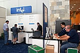 Intel sponsor/exhibitor booth staff members set up the Advanced Technology Zone featuring Intel Virtualization Technology on Level Two at Moscone West in San Francisco, Calif., on Monday, August 22, 2005. (Photo by Intel Press Relations)