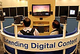 IDF attendees relax in the Digital Home Community booth at the Fall Intel Developer Forum held at Moscone West on Tuesday, August 23, 2005 in San Francisco, Calif. (Photo by Intel Press Relations)