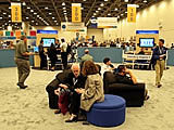 IDF attendees relax in the Digital Home Community booth at the Fall Intel Developer Forum held at Moscone West on Tuesday, August 23, 2005 in San Francisco, Calif. (Photo by Intel Press Relations)