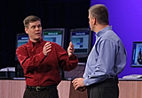 Brendan Traw, an Intel Fellow (left) talks to Donald J. MacDonald, Intel's Vice President, General Manager Digital Home Group (right), during his keynote held at the Intel Developer Forum in San Francisco, Calif., on Wednesday, August 24, 2005. (Intel Press Relations)