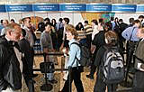 IDF attendees lineup for self check-in & badge pick-up before the start of Day One Keynotes at the Intel Developers Forum Fall 2005 at Moscone West on Tuesday, August 23, 2005 in San Francisco, Calif. (Intel Press Relations)