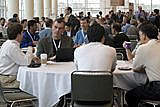 Intel's Louis J. Burns, cq, vice president, general manager, digital health group, second from left, meets with IDF attendees at breakfast before the Keynote:Day two at the Intel Developer Forum Fall 2005 held on Level 3 at Moscone West on Wednesday, August 24, 2005 in San Francisco, Calif. (Photo by Intel Press Relations)