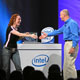 Rhoulette, left, from the Ubisoft-sponsored girl-gamer team Frag Dolls, and Sean Maloney, executive vice president and chief sales and marketing officer of Intel Corp., shake hands after a gaming demonstration of the new Intel® Core™2 Duo processor, Thursday, July 27, 2006, during an event at Intel headquarters in Santa Clara, Calif.